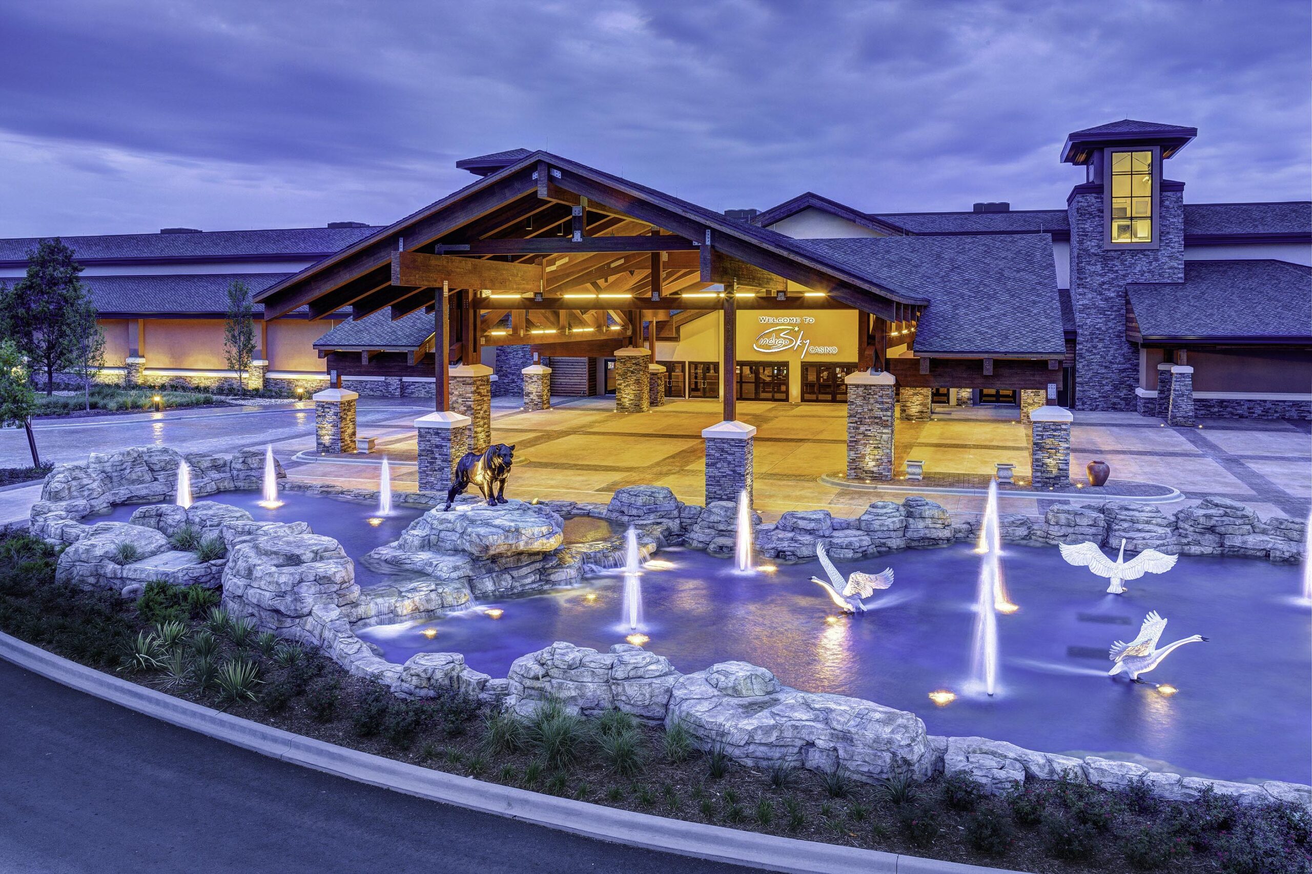 Indigosky web 5 A large pool welcomes visitors to this wilderness themed casino. The water feature has spouts of water and rock pillars, accented with underwater lights.
